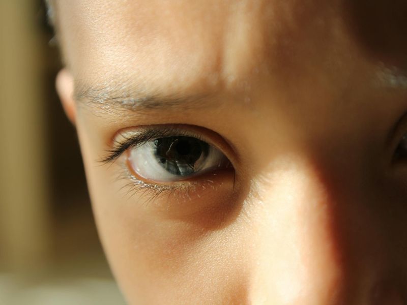 Detailed view of eyes focusing on light patterns